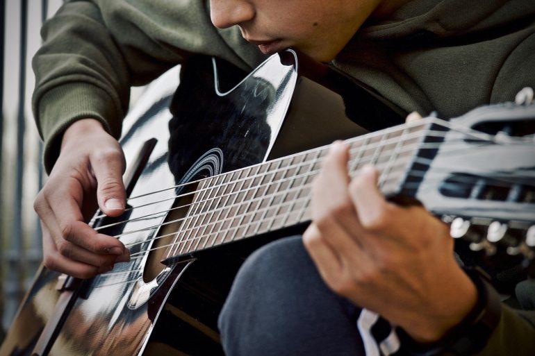 Guitar Guitarist Musical Instrument  - sweetlouise / Pixabay